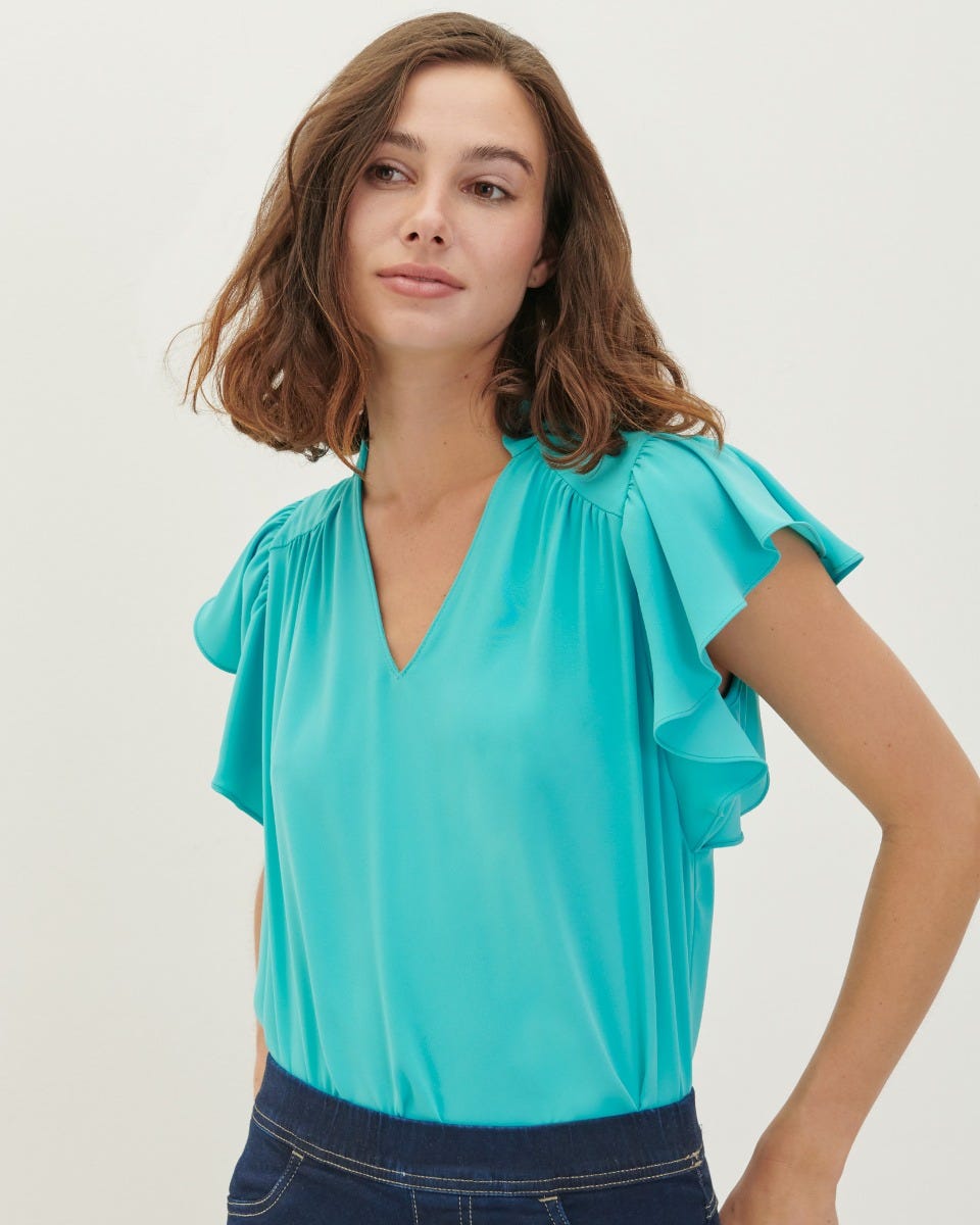 Blusas con escarolas hotsell en el cuello
